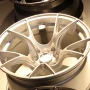 Silver multi-spoke alloy car wheel