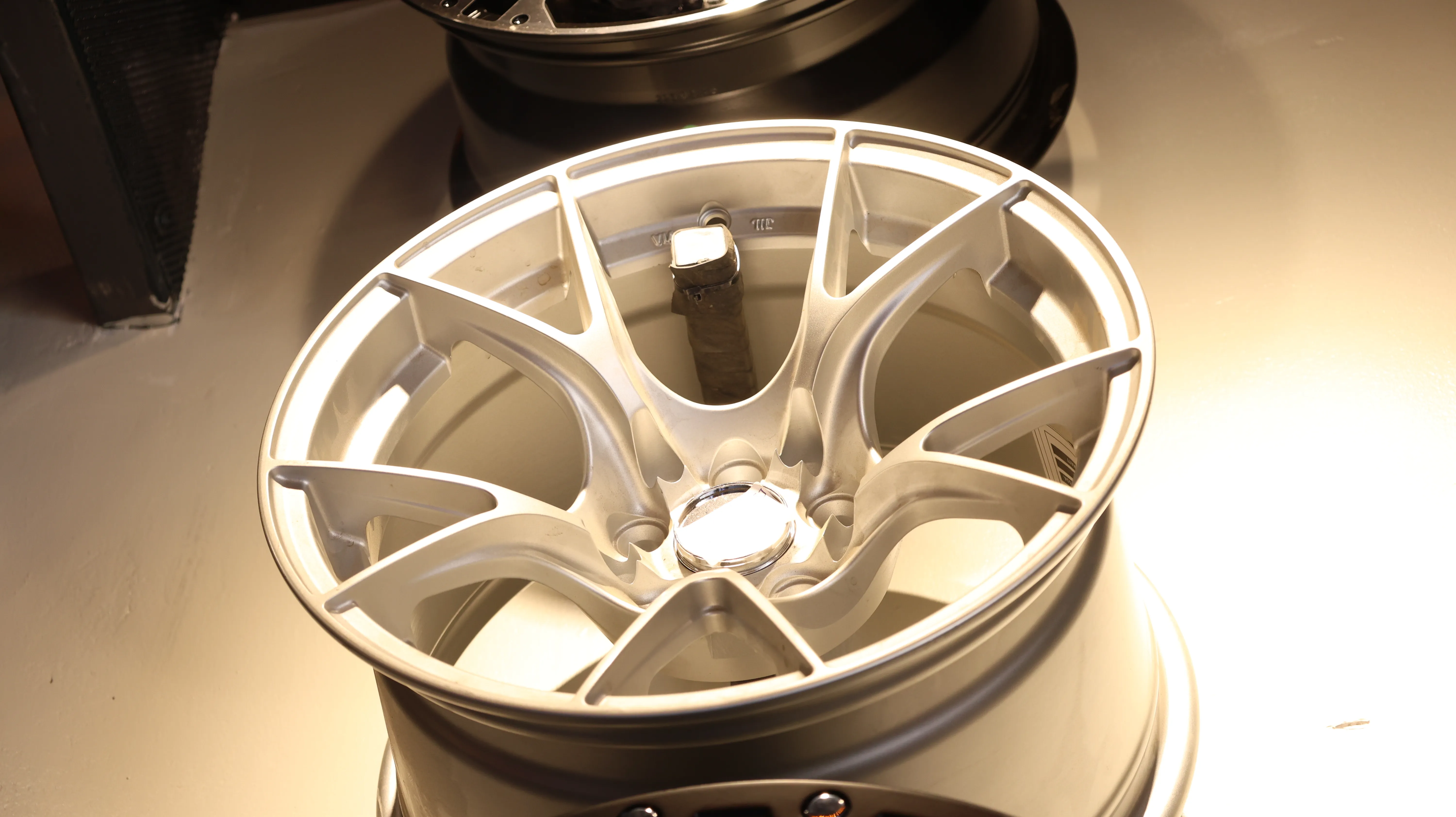 Silver multi-spoke alloy car wheel